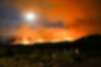 wildfire spreading on a hillside